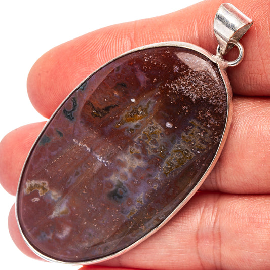 Red jasper cabochon pendant, oval stone with silver-plated bezel and bail