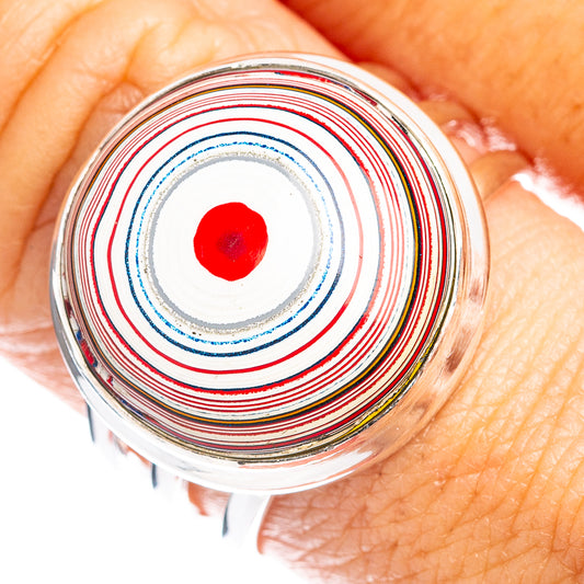 Sterling silver ring with layered red, blue, and gold concentric inlay