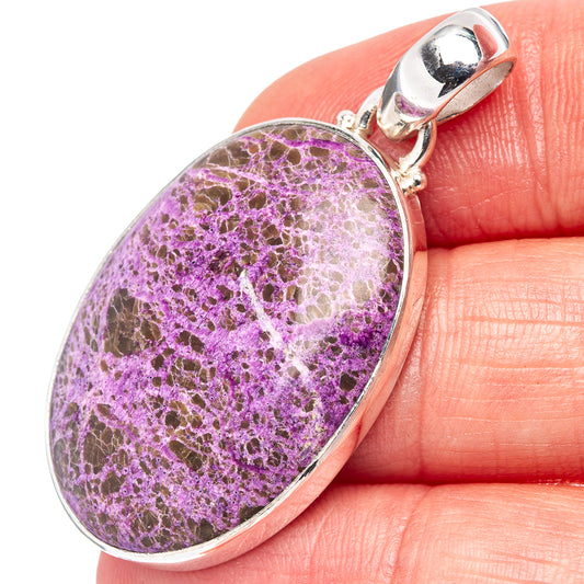 Oval purple stichtite pendant in sterling silver bezel with top bail