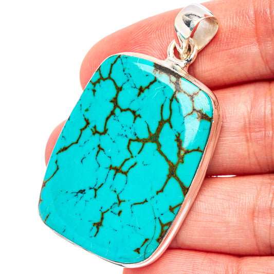 Turquoise stone pendant with .925 sterling silver bezel and loop bail, close-up