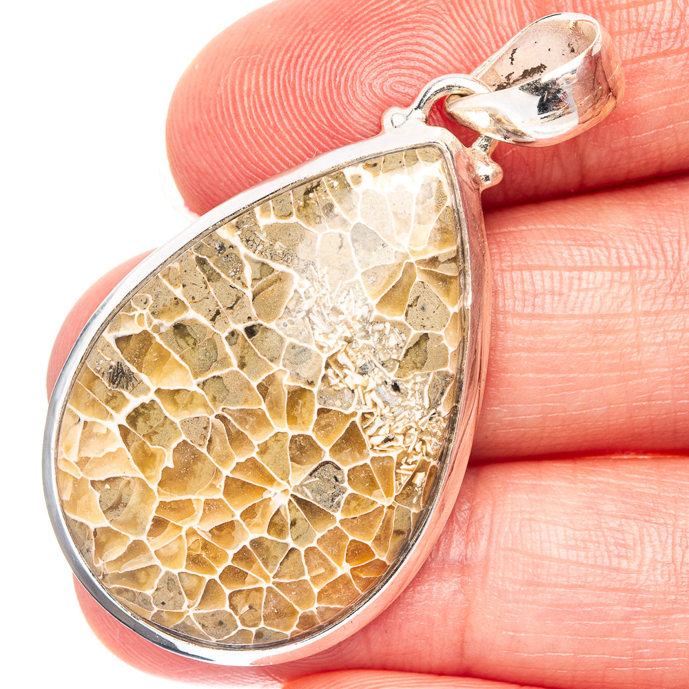 Sterling silver teardrop pendant with agatized fossil coral pattern, gold-brown
