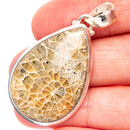 Sterling silver teardrop pendant with agatized fossil coral pattern, gold-brown