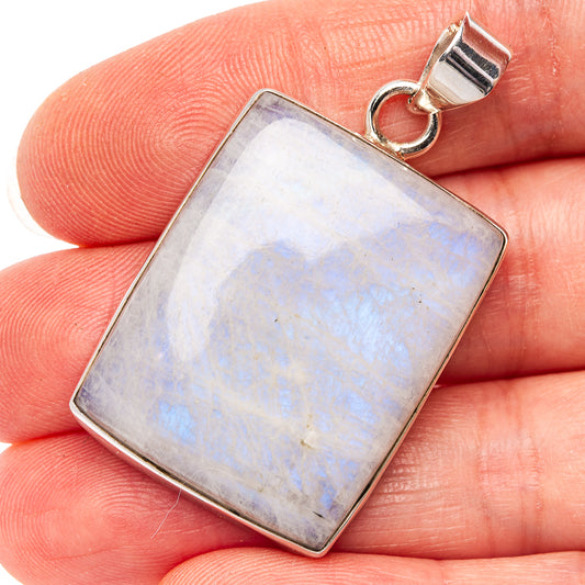 Rectangular moonstone pendant with rainbow sheen in silver bezel and bail