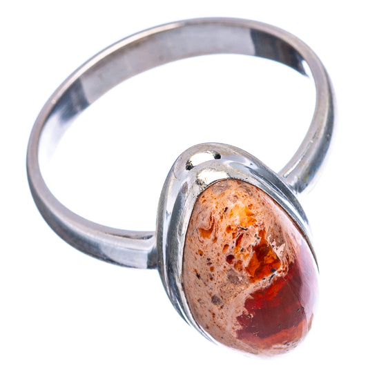 Sterling silver ring featuring an oval fire opal cabochon with orange and red swirls.