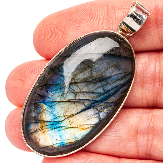 Labradorite pendant in oval .925 sterling silver bezel with blue flash, small bail
