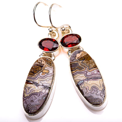 Sterling silver drop earrings with two marbled ovals and round red garnet accents