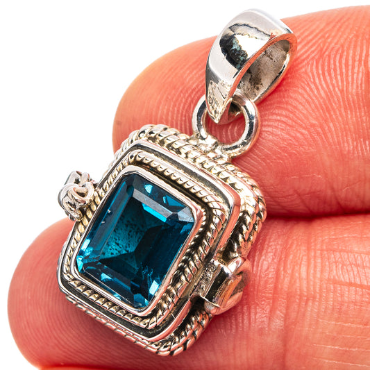 925 sterling silver pendant with rectangular blue topaz-style gemstone, ornate frame