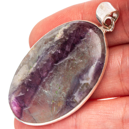 Silver-plated fluorite pendant with oval dark purple and gray stone, hinged bail
