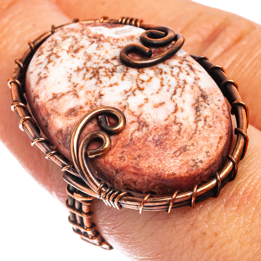 Oxidized copper wire-wrapped jasper ring with oval stone and curled wire details