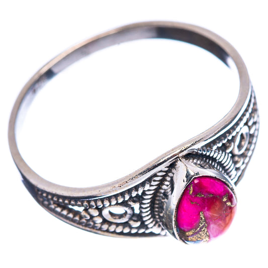 Sterling silver filigree band ring with oval pink-teal cabochon, side view