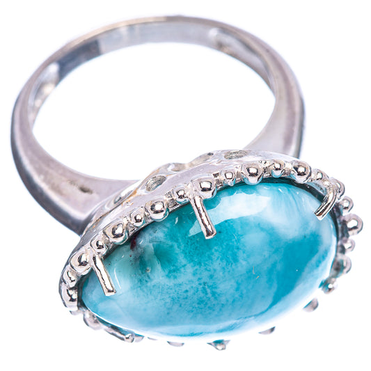 Sterling silver larimar ring, side view of oval blue stone in raised prong mount