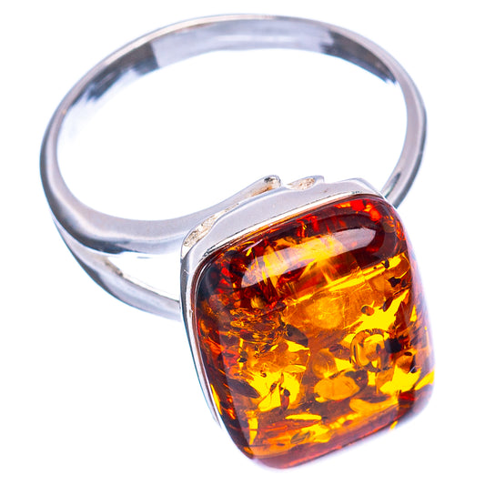 Adjustable sterling silver ring with yellow-orange Baltic amber stone bezel
