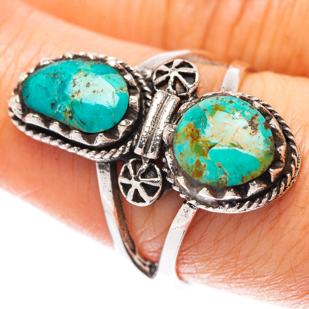 925 sterling silver ring with two oval turquoise cabochons and ornate side detailing