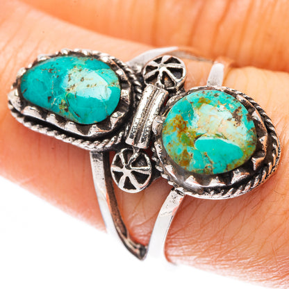 925 sterling silver ring with two oval turquoise cabochons and ornate side detailing