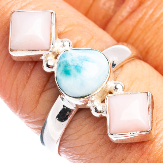 Sterling silver ring with blue oval center and two pink opal square side stones