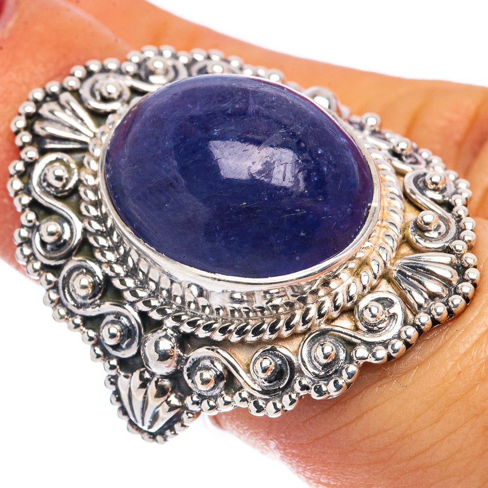 Sterling silver ring with oval blue-violet gemstone and ornate filigree setting