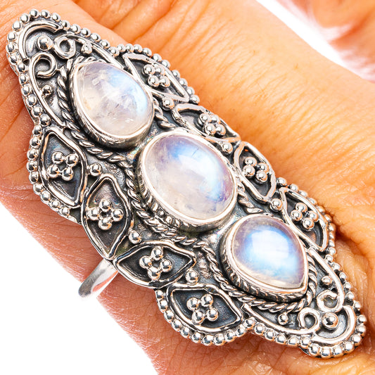 Sterling silver moonstone ring with three iridescent oval stones, ornate filigree band