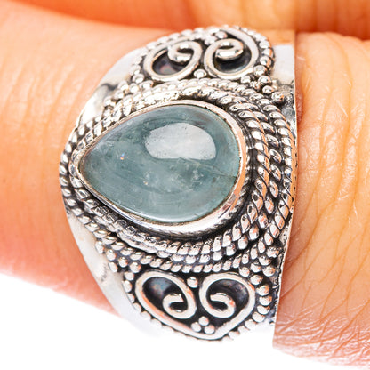 Sterling silver ring with oval aquamarine blue gemstone and ornate filigree bezel
