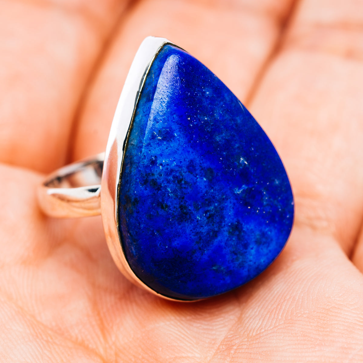 Sterling silver ring with large blue teardrop gemstone, side view, size 9.75