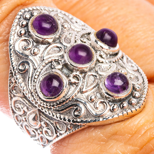 Sterling silver amethyst ring with four purple cabochon stones and ornate filigree
