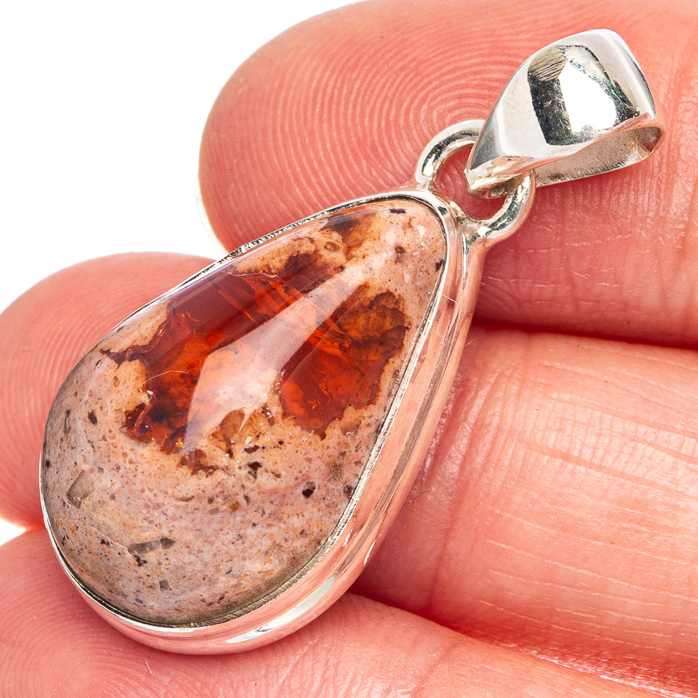 Sterling silver teardrop fire opal pendant with orange-red cabochon and polished bail.