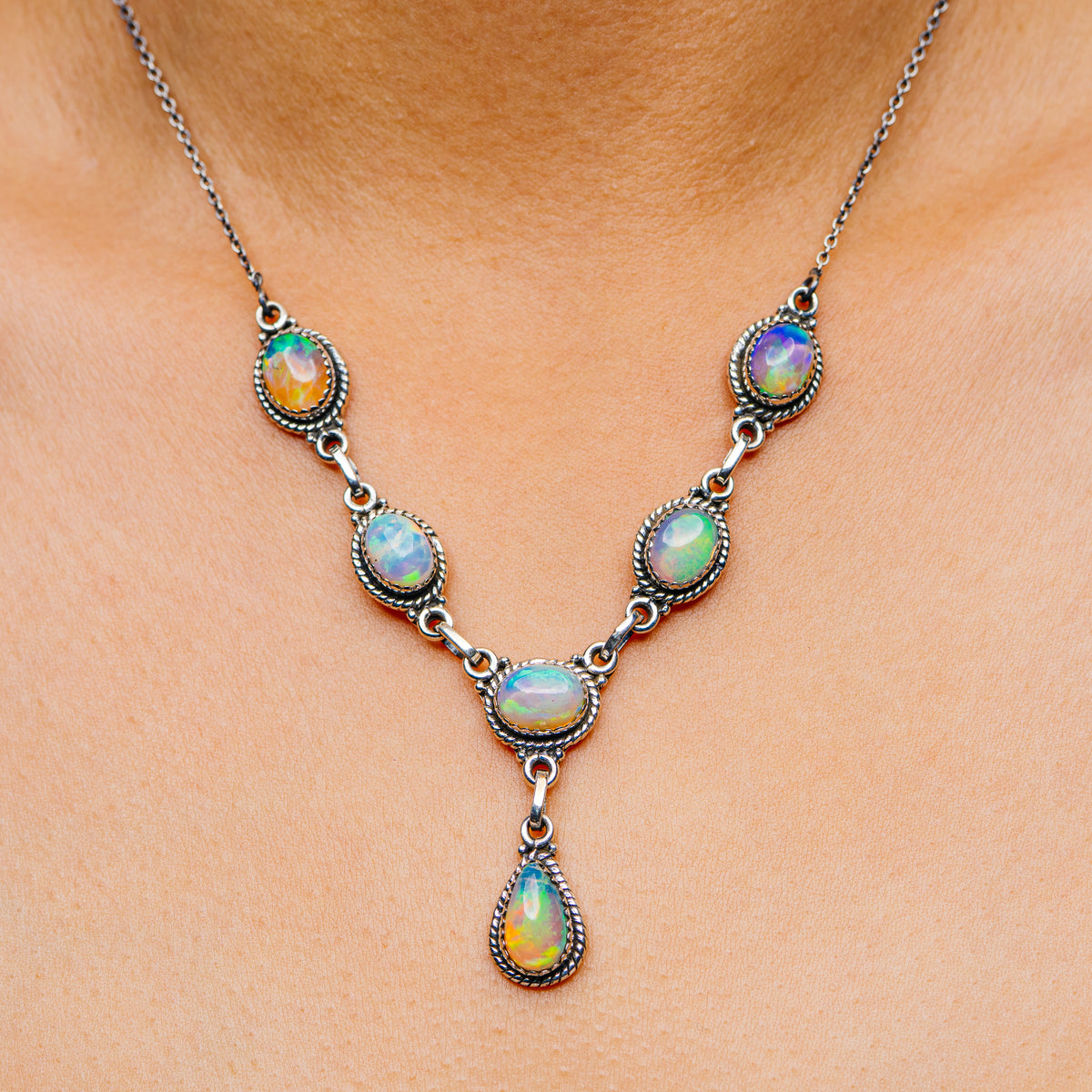 Sterling silver opal necklace with five teardrop gemstones and link chain