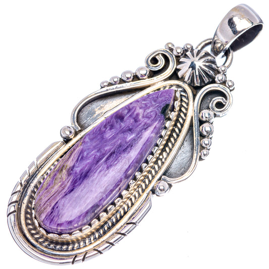 Oval purple charoite pendant with ornate sterling silver bezel and top bail