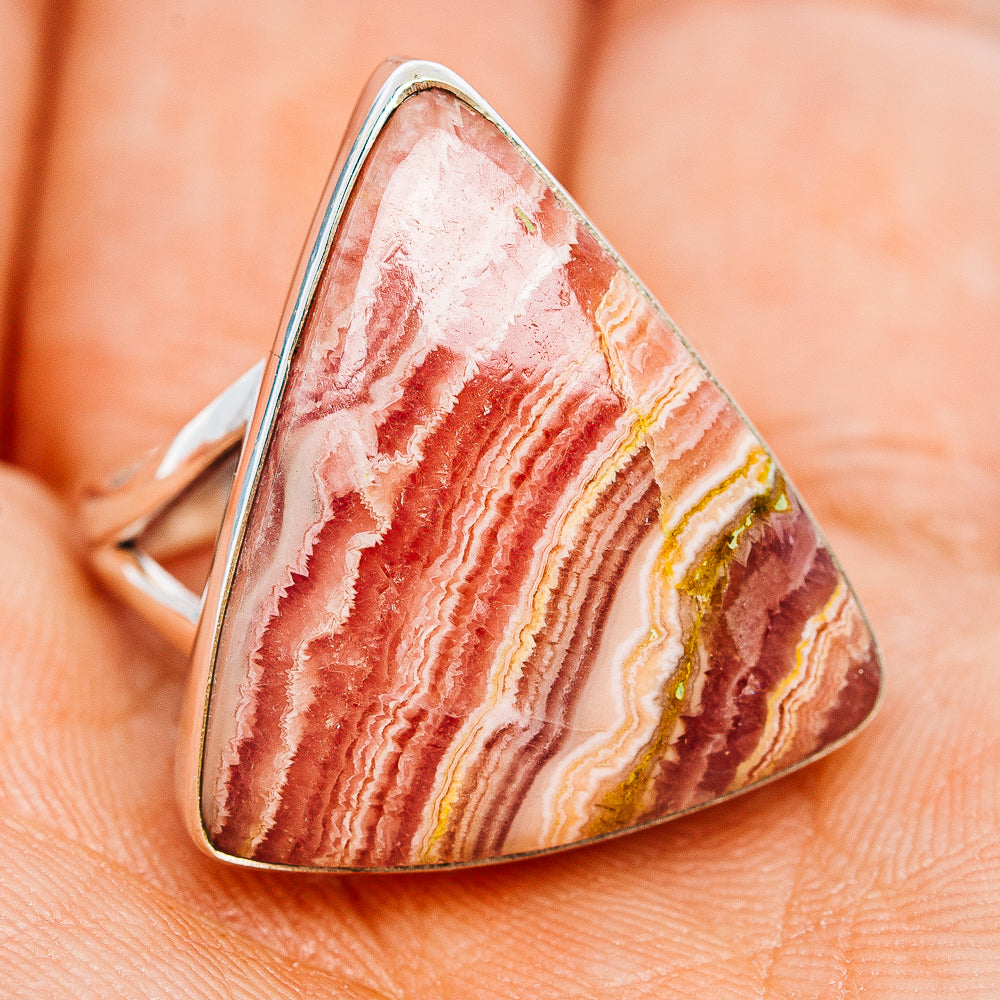 Sterling silver rhodochrosite ring with faceted oval pink stone and red-white bands
