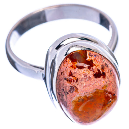 Sterling silver ring with oval fire opal cabochon, orange-red with dark inclusions