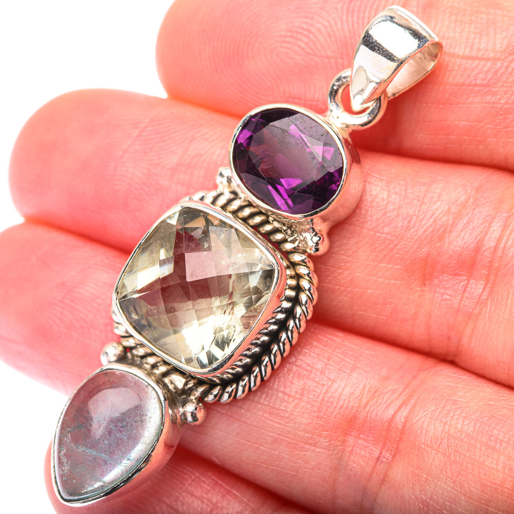 Sterling silver gemstone pendant with oval purple and pale stones, rope bezels