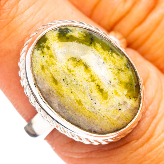 Sterling silver lizardite ring with oval yellow-green speckled cabochon, size 7.5
