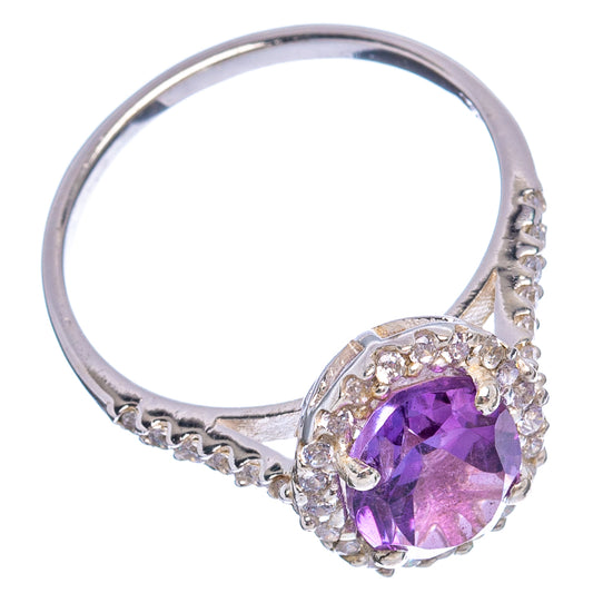Sterling silver ring with round purple amethyst center and cubic zirconia accents