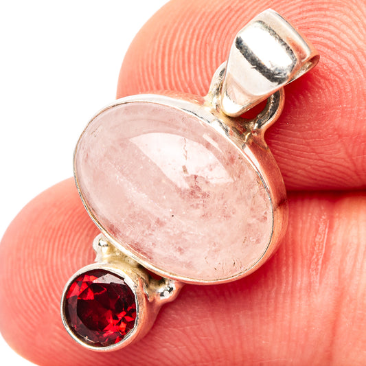 Sterling silver morganite and garnet pendant with oval morganite and red round garnet.