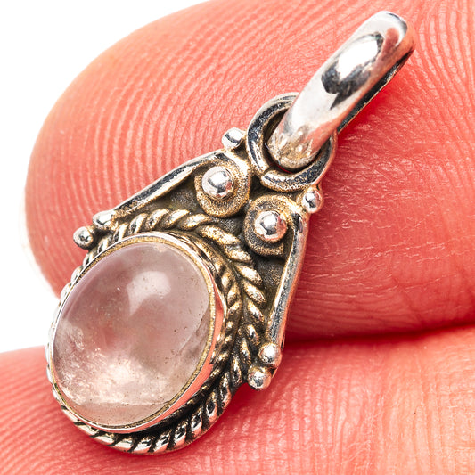 Dainty rose quartz pendant with oval pink stone in .925 sterling silver frame