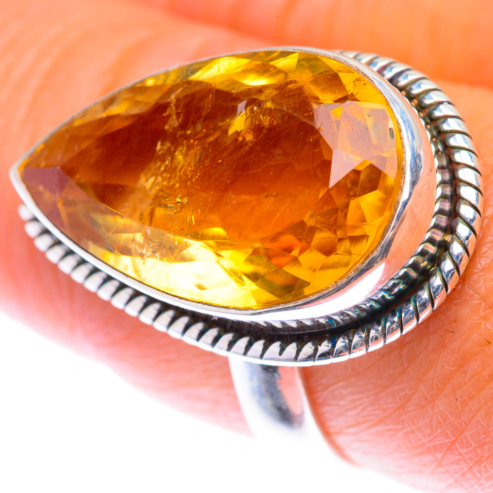 Faceted citrine gemstone ring with oval sterling silver bezel and rope edge