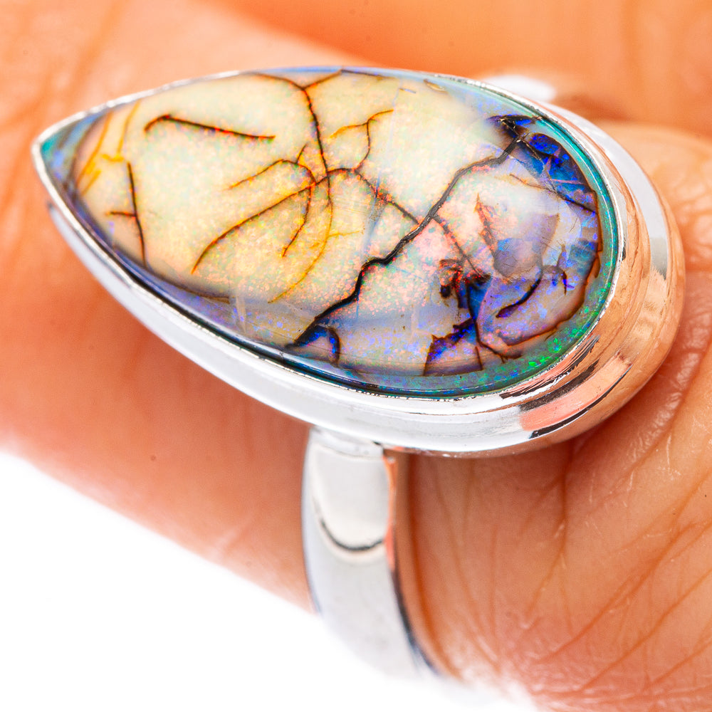 Sterling silver oval opal ring with rainbow blue, green, and orange stone bezel
