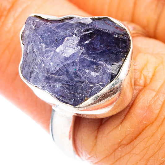 Sterling silver tanzanite ring with dark blue rough stone bezel and prong setting