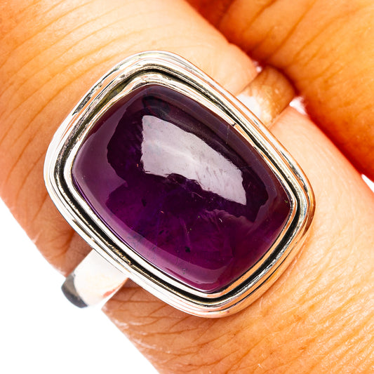 Oval amethyst gemstone ring in .925 sterling silver with raised silver frame