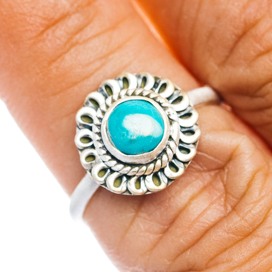 Turquoise cabochon sterling silver ring with ornate round setting