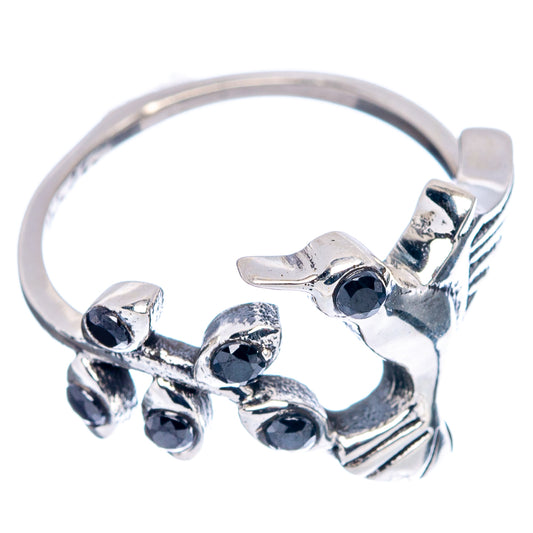 Sterling silver hummingbird ring with black onyx-style stones, side view