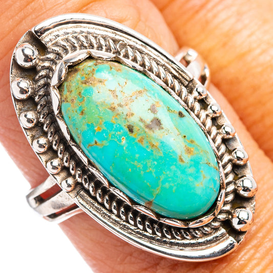 Oval turquoise cabochon sterling silver ring with ornate rope and bead setting