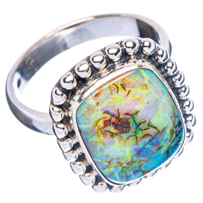 Sterling silver opal ring with oval stone and raised beaded gallery on slim band