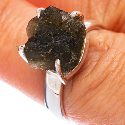 Sterling silver moldavite ring with rough dark green gemstone, open prong setting
