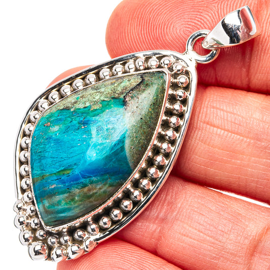 Sterling silver opal pendant with teardrop bezel and scalloped border