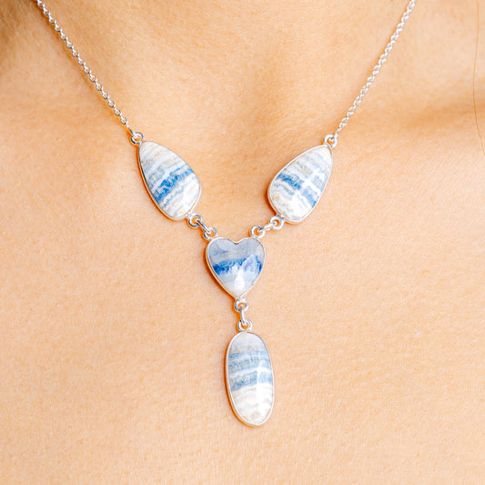 Blue scheelite heart necklace with silver chain and three heart pendants
