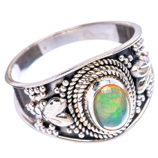 Sterling silver opal ring, oval green opal set in detailed floral and rope pattern