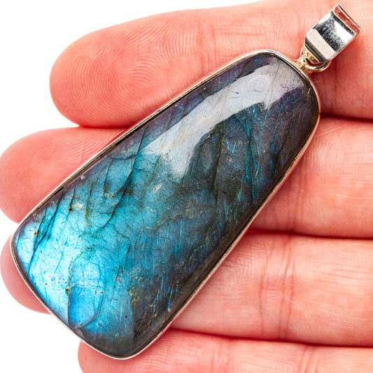Labradorite pendant in oval sterling silver bezel, blue and dark stone with silver bail