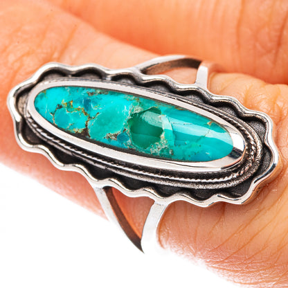 Oval turquoise cabochon ring in 925 sterling silver with decorative raised bezel