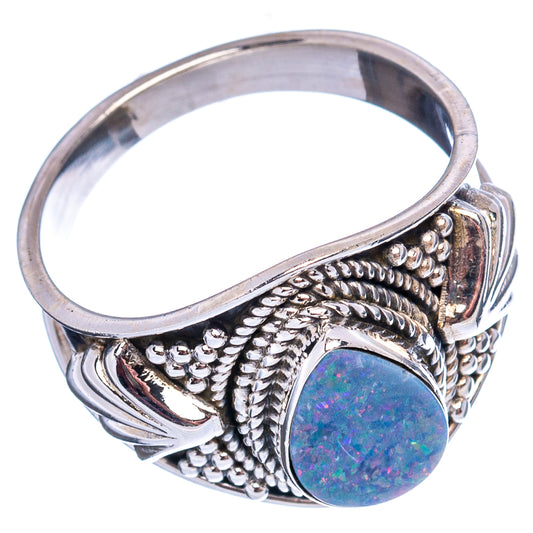 Sterling silver opal ring with oval doublet stone in ornate beaded bezel, side view