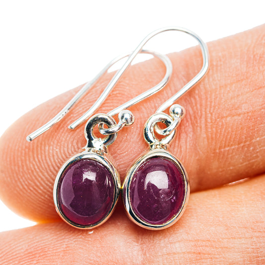 Sterling silver ruby drop earrings with oval deep purple stones on lever hooks